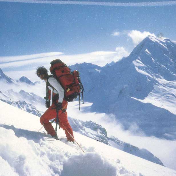 Hiking in snow on Mountain - hiking backpack