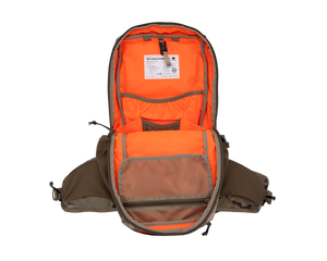 Close up of day pack shoulder strap with multiple pocket options showing cell phone carry on user&#39;s left strap