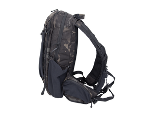 Close up of day pack shoulder strap with multiple pocket options showing cell phone carry on user&#39;s left strap