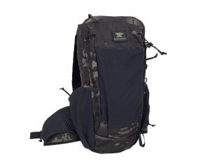 Close up of day pack shoulder strap with multiple pocket options showing cell phone carry on user&#39;s left strap