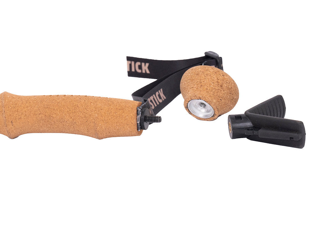 Close up view of cork trekking pole handle with removable cap and accessory V-cradle (Included)